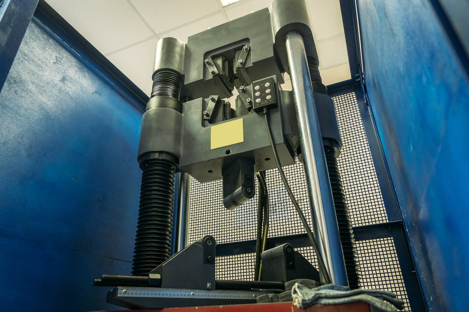 Machine for testing metals for strength and deformation in laboratory at metallurgical plant.
